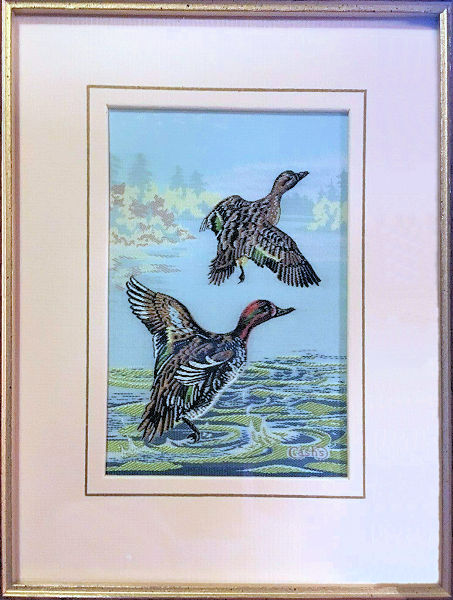 J & J Cash woven picture of ducks, with no words, but image of a pair of Green-Winged Teal