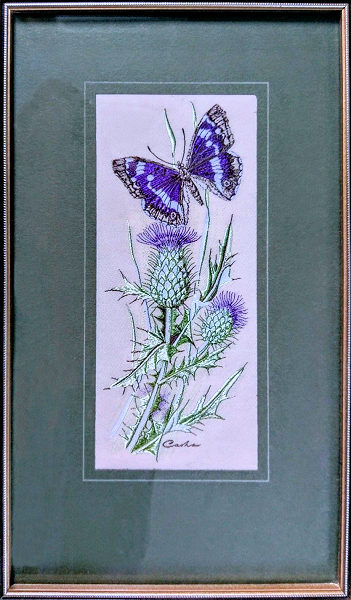 J & J Cash woven picture with no words, but image of a Purple Emperor butterfly & Spear Thistle