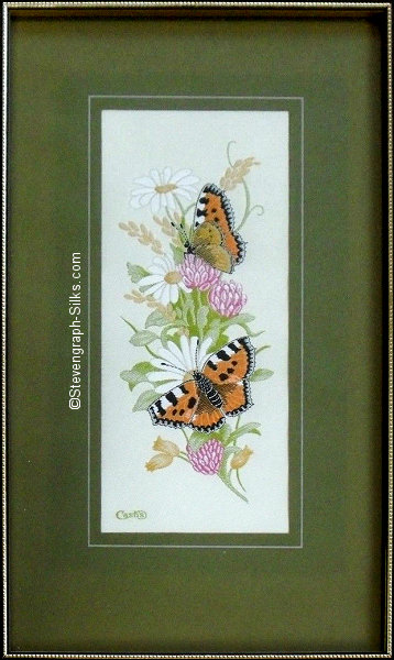 J & J Cash woven picture with no words, but image of a Tortoiseshell Butterfly with Clover and Daisy flowers