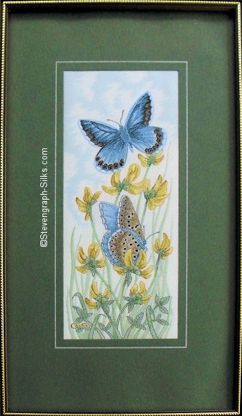 J & J Cash woven picture with no words, but image of a Common Blue butterfly and yellow flowers