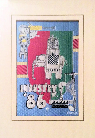 J & J Cash woven picture with various symbols representing the diverse industry of Coventry in 1986