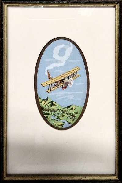 J & J Cash small oval centred woven picture with image of an aeroplane