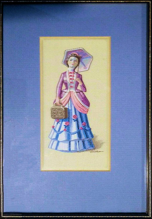 J & J Cash woven picture with no words, but image of standing lady with parosole