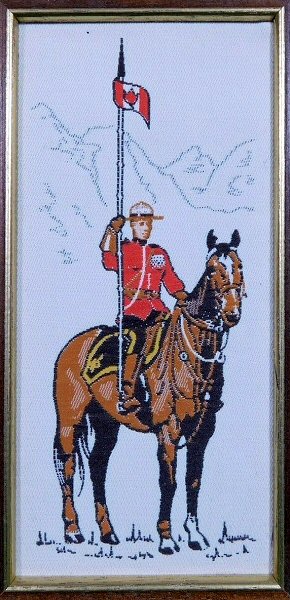 J & J Cash woven picture with image of a Royal Canadian Mountie