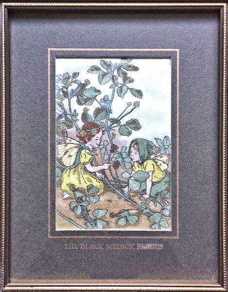J & J Cash woven picture with THE BLACK MEDICK FAIRIES title words, and image of two fairies with branches, leaves and berries