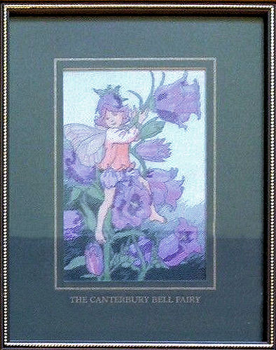J & J Cash woven picture with CANTERBURY BELL FAIRY title and image of a red and yellow fairy