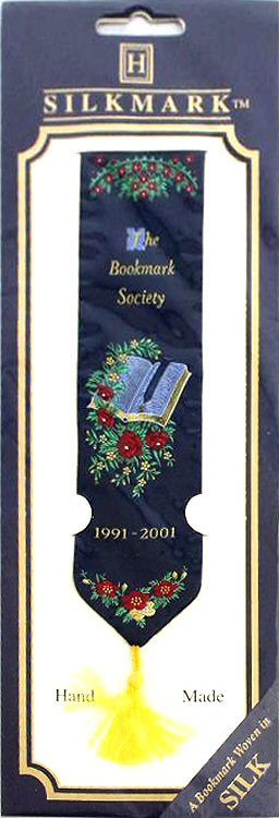 woven bookmark with The Bookmark Society 1991 - 2001 words, and image of an open book with bookmark