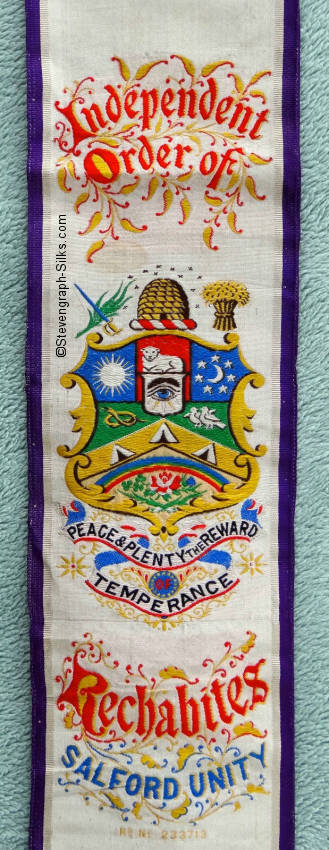 sash with central picture and title words, with regisration number woven beneath