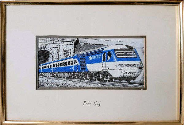 Framed woven picture of an Inter City train