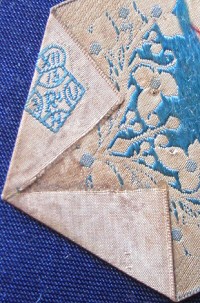 woven diamond registration on reverse pointed end of this bookmark