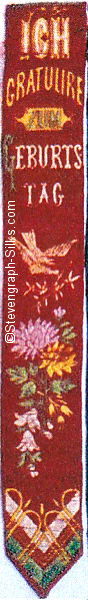 Silk bookmark with title in german words and image of bird and flowers