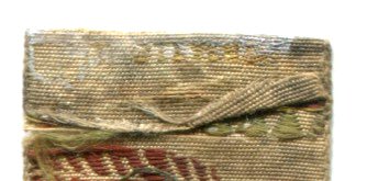 view of reverse top turn over of this bookmark, with letters of part of T. STEVENS name visible