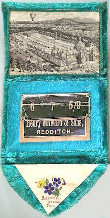 needle case, with woven silk on the fold over flap, with words "Blessings Attend Thee", and view of the Edinburgh Exhibition, 1886