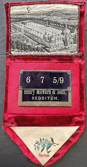 needle case, with woven silk on the fold over flap, with word "SOUVENIR", and view of the Edinburgh Exhibition, 1886