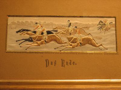 Image of the three groups of horses racing to the finishing line, with German words on card mount