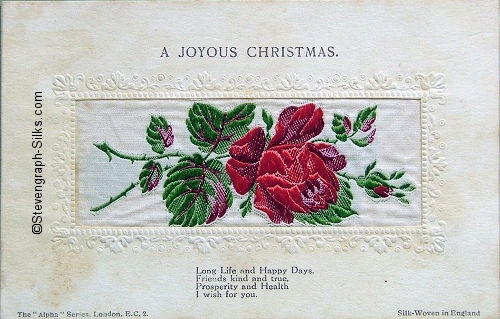 Alpha series postcard with no woven words, just image of a single rose and rose bud, with printed title and words below silk