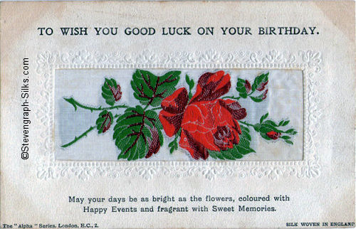 Alpha series postcard with no woven words, just image of a single rose and rose bud, with printed title and words below silk