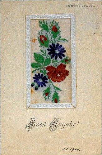 postcard with part of a Stevens woven silk bookmark, showing various flowers and buds