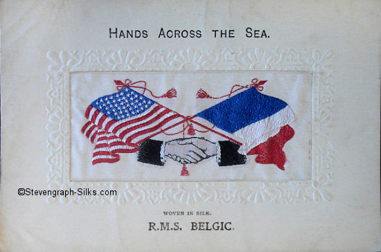 image of USA and Frence flags, with two men's hands