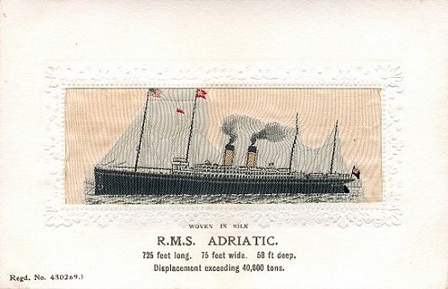 Ocean liner at anchor, with two funnels and four masts