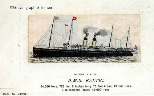 Ocean liner at anchor with two funnels and four masts.
