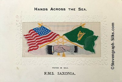 image of shaking hands, flags and tassles