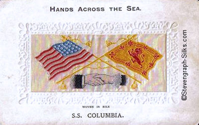 image of shaking hands, flags and tassles