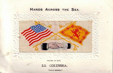 image of shaking hands, flags and tassles