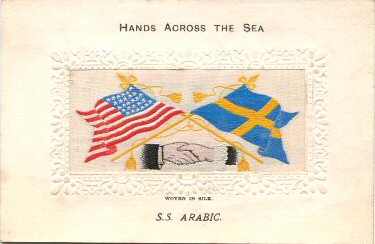 image of shaking hands, flags and tassles