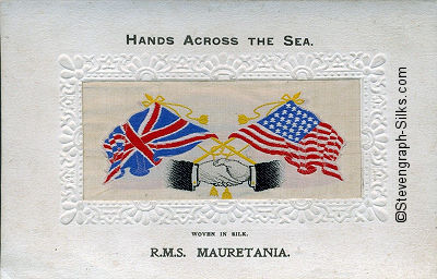 image of shaking hands, flags and tassles