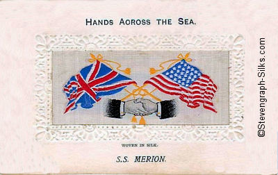 image of shaking hands, flags and tassles