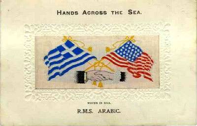 image of shaking hands, flags and tassles