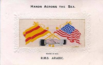 image of shaking hands, flags and tassles